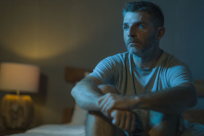 Man sitting alone in the dark